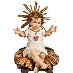 Niño Jesús vestido con Corazón sentado en cuna